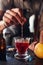 Bartender hand stirring a negroni cocktail