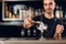 Bartender Making Cocktail. Barman Putting Ice In Glass