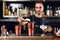 Bartender Making Cocktail. Barman Putting Ice In Glass