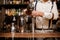 Bartender making coctail at the bar counter