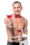 Bartender, with a naked torso gives a glass of ine