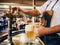 Bartender pouring the fresh beer in one of Czech traditional pub