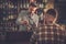 Bartender pouring a pint of beer to customer in a pub.