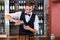 Bartender pouring tequila into shot glasses