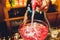 Bartender prepares a great cocktail close-up on the background of the bar.