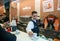 Bartender serves coffee in a cafe at the station