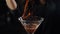 Bartender sets fire to cocktail, burning cinnamon in alcohol drink on black background. Flames in cocktail glass in slow