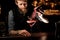 Bartender sprinkles an alcohol cocktail in glass