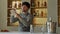 Bartender wipes an empty martini glass with a clean napkin