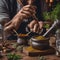 A bartenders hands crushing herbs and spices with a mortar and pestle2
