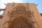 Bas-relief of entrance to Gothic Valencia Cathedral building facade