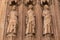 Bas-relief of people figures on Gothic Valencia Cathedral building facade