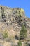 Basalt cliff with trees in dry fall under blue sky in Central Washington