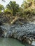 Basalt columns line the side of a bend in the river course in the Alcantara gorge near Taormina, Sicily