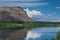 Basalt mountain cliffs overlooking columbia river grant county mattawa with crystal blue skies and reflection in the water