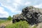 Basalt rock formation on a hill former stone quarry