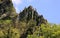 Basaltic columns emerging from forest, at Detunata