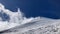 Base of the mountain with a glacier in the middle of a sunny day with a blue sky and a lot of ice with a group of climbers going d