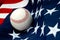 A baseball on the American flag