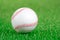 Baseball ball on a green grass