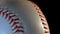 Baseball ball isolated on black background/Red seam on white ball