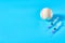 Baseball ball near syringe on blue background. Concept of doping in professional sport