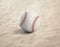 Baseball ball on the sand, beach, sea