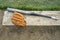 Baseball bat and glove on a wood bench