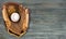 Baseball catcher equipment on wooden background