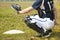 Baseball catcher ready to catch ball at home plate