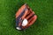 Baseball glove and ball on grass