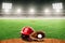 Baseball Glove, Ball, and Helmet on Field in Outdoor Stadium With Copy Space