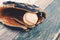 Baseball and glove on dugout bench