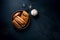 Baseball gloves and ball isolated on dark background. Top view.