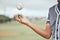 Baseball, hand and athlete holding a ball on an outdoor field for a match or sports training. Softball, sport and man