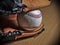Baseball leather glove with ball on a wooden surface