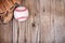 Baseball and mitt on wooden background