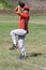 Baseball pitcher winds up to throw the ball