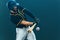 Baseball player with bat taking a swing on grand arena. Ballplayer on dark background in action.