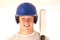 Baseball player portrait smiling holding bat