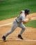 Baseball Player Running Down Base Path.