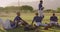 Baseball players sitting on a ground