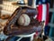 Baseball sitting in old fashioned glove with American flag in background