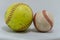 Baseball and softball on a white background