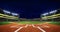 Baseball stadium infield diamond view illuminated at night