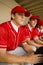 Baseball Team Mates Sitting In Dugout