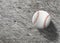 Baseball on wooden board turf close-up. Top view