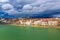 Basel architecture along Rhine River and storm clouds in Basel, Switzerland.