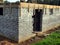 Basement wall of concrete blocks on the ground clay