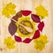 Bashkir honey on wooden table decorated with autumn leaves served in a bowl with a wooden spoon